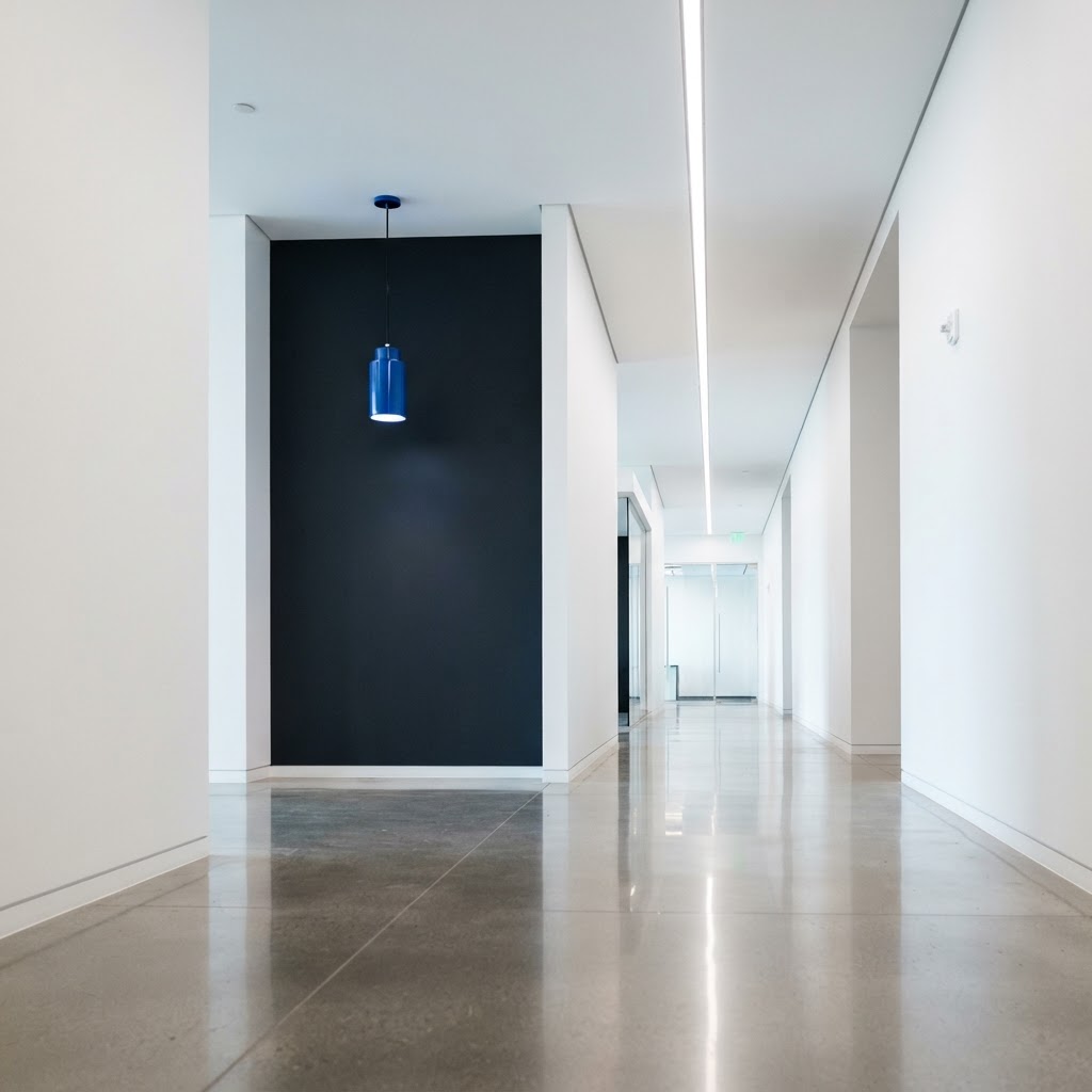 Clean minimalist office interior with high contrast architectural elements