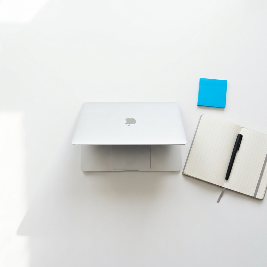 Minimalist workspace with hidden-screen laptop and blue accent